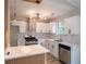 Updated kitchen with white cabinetry, modern countertops, and stainless steel appliances at 5072 Plantation View Trl, Stone Mountain, GA 30088