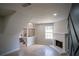 Inviting living room with a fireplace, staircase, and detailed tile flooring at 5072 Plantation View Trl, Stone Mountain, GA 30088