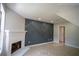 Cozy living room with a decorative wall design, recessed lighting, fireplace, and neutral tile flooring at 5072 Plantation View Trl, Stone Mountain, GA 30088