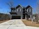 Charming two-story home with attached garage and new concrete driveway at 5518 Legacy Trl, Douglasville, GA 30135