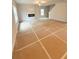 Bright living room area with a modern fireplace and a large window for natural light at 5518 Legacy Trl, Douglasville, GA 30135