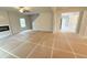 Open living room with a fireplace, staircase, and abundant natural light at 5518 Legacy Trl, Douglasville, GA 30135