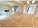 Spacious living room featuring a modern fireplace, ceiling fan, and ample natural light at 5518 Legacy Trl, Douglasville, GA 30135