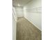 Spacious walk-in closet with carpeted flooring and wire shelving at 5518 Legacy Trl, Douglasville, GA 30135