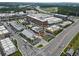 This aerial view captures the dynamic layout of a mixed-use development, highlighting commercial zones and busy streets at 6460 Cortland Walk, Alpharetta, GA 30005