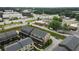 Aerial view of townhomes near commercial area, with easy access to shops, restaurants, and major roads at 6460 Cortland Walk, Alpharetta, GA 30005