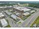 An aerial shot captures the layout of the Halcyon community with commercial and residential buildings and ample parking at 6460 Cortland Walk, Alpharetta, GA 30005