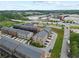 Scenic aerial view of newly built townhomes, showcasing modern architecture and community layout near green space at 6460 Cortland Walk, Alpharetta, GA 30005