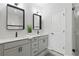 Bathroom showcasing double sinks, square mirrors, modern lighting, and gray vanity cabinets at 6460 Cortland Walk, Alpharetta, GA 30005
