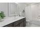 Bright bathroom featuring modern vanity with white countertop and shower-tub combination at 6460 Cortland Walk, Alpharetta, GA 30005