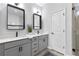Bright bathroom with double vanities and a modern glass shower at 6460 Cortland Walk, Alpharetta, GA 30005