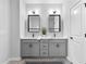 Contemporary bathroom with double sinks and stylish fixtures at 6460 Cortland Walk, Alpharetta, GA 30005