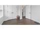 Bedroom with wood floors, double closets, and white trim at 6460 Cortland Walk, Alpharetta, GA 30005