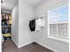 Walk-in closet with built-in shelving and natural light from the window at 6460 Cortland Walk, Alpharetta, GA 30005