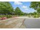 Outdoor community space featuring tables, chairs, and a pergola-covered area for gatherings at 6460 Cortland Walk, Alpharetta, GA 30005
