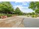 Inviting community area with picnic tables, fireplace, and outdoor seating, perfect for gatherings and relaxing at 6460 Cortland Walk, Alpharetta, GA 30005