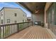 Relaxing deck with outdoor seating, fan, and string lights, perfect for enjoying the neighborhood view at 6460 Cortland Walk, Alpharetta, GA 30005