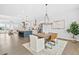 Open floor plan with dining area adjacent to kitchen with a modern chandelier at 6460 Cortland Walk, Alpharetta, GA 30005