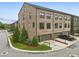 Beautiful new brick townhome featuring a two-car garage and well-manicured landscaping at 6460 Cortland Walk, Alpharetta, GA 30005