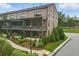 Stunning brick townhome with covered patios and manicured landscaping, located on a corner lot at 6460 Cortland Walk, Alpharetta, GA 30005