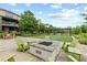 Charming fire pit area with comfortable seating perfect for enjoying cozy evenings in the neighborhood at 6460 Cortland Walk, Alpharetta, GA 30005