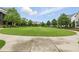 Expansive community green space with walking path and benches, perfect for recreation at 6460 Cortland Walk, Alpharetta, GA 30005