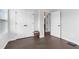 Hallway featuring hardwood floors, a double door closet and natural light at 6460 Cortland Walk, Alpharetta, GA 30005