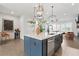Spacious kitchen featuring an island, stainless steel dishwasher and hardwood flooring throughout at 6460 Cortland Walk, Alpharetta, GA 30005