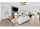 Bright living room adjacent to kitchen with cozy fireplace and open layout at 6460 Cortland Walk, Alpharetta, GA 30005