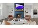 Cozy living room features a fireplace, stylish decor, and an open layout flowing into the kitchen at 6460 Cortland Walk, Alpharetta, GA 30005