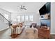 Cozy living room with fireplace, comfortable seating, and natural light at 6460 Cortland Walk, Alpharetta, GA 30005