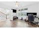 Living room featuring hardwood floors and a staircase at 6460 Cortland Walk, Alpharetta, GA 30005