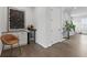 Stylish living space featuring a bar with wine fridge and hardwood flooring at 6460 Cortland Walk, Alpharetta, GA 30005