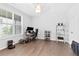 Office features hardwood floors and natural light from the window at 6460 Cortland Walk, Alpharetta, GA 30005