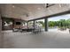 Stylish outdoor lounge area with a fireplace, comfortable seating, bar and a view of the pool at 6460 Cortland Walk, Alpharetta, GA 30005