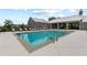 Inviting community pool with lounge chairs and umbrellas, perfect for relaxation and outdoor enjoyment in a modern setting at 6460 Cortland Walk, Alpharetta, GA 30005