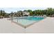 Community pool with clean lines and inviting waters, surrounded by ample seating for relaxation and socializing at 6460 Cortland Walk, Alpharetta, GA 30005