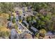 Aerial view of apartments nestled among trees, featuring ample parking and community pool at 765 Houston Mill Ne Rd # 7, Atlanta, GA 30329