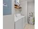 Functional laundry room with washer, dryer, water heater, and shelving for storage at 765 Houston Mill Ne Rd # 7, Atlanta, GA 30329
