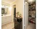 Bathroom features a vanity, toilet, a walk-in closet, and tile floors at 1207 Summit North Ne Dr # 1207, Atlanta, GA 30324