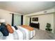 The main bedroom features a queen-sized bed, carpeted floors, dark furniture, and natural light from a window at 1207 Summit North Ne Dr # 1207, Atlanta, GA 30324