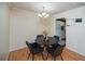 Inviting dining room features hardwood floors, stylish lighting, and an open layout to the kitchen at 1207 Summit North Ne Dr # 1207, Atlanta, GA 30324