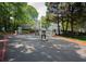 Gated community entrance surrounded by mature trees and landscaping adding an extra element of security and privacy at 1207 Summit North Ne Dr # 1207, Atlanta, GA 30324