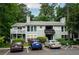 Exterior view of the condominium complex, featuring well-maintained landscaping and ample parking space at 1207 Summit North Ne Dr # 1207, Atlanta, GA 30324