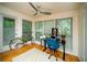 Sunlit home office with hardwood floors, large windows, and a view of the lush outdoors at 1207 Summit North Ne Dr # 1207, Atlanta, GA 30324