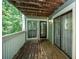 Charming outdoor patio with wooden floors and railings, offering scenic views and sliding glass door access at 1207 Summit North Ne Dr # 1207, Atlanta, GA 30324