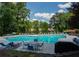 Large swimming pool with plenty of chairs and seating areas, perfect for relaxing and enjoying the outdoors at 1207 Summit North Ne Dr # 1207, Atlanta, GA 30324