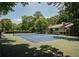 Well-maintained community tennis court surrounded by lush trees, ideal for sports and recreation at 1207 Summit North Ne Dr # 1207, Atlanta, GA 30324