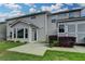 Back of house featuring sunroom, a storage shed, and lush landscaping at 1891 Primrose Park Rd, Sugar Hill, GA 30518