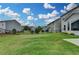 Spacious, fenced backyard featuring green grass and some landscaping at 1891 Primrose Park Rd, Sugar Hill, GA 30518